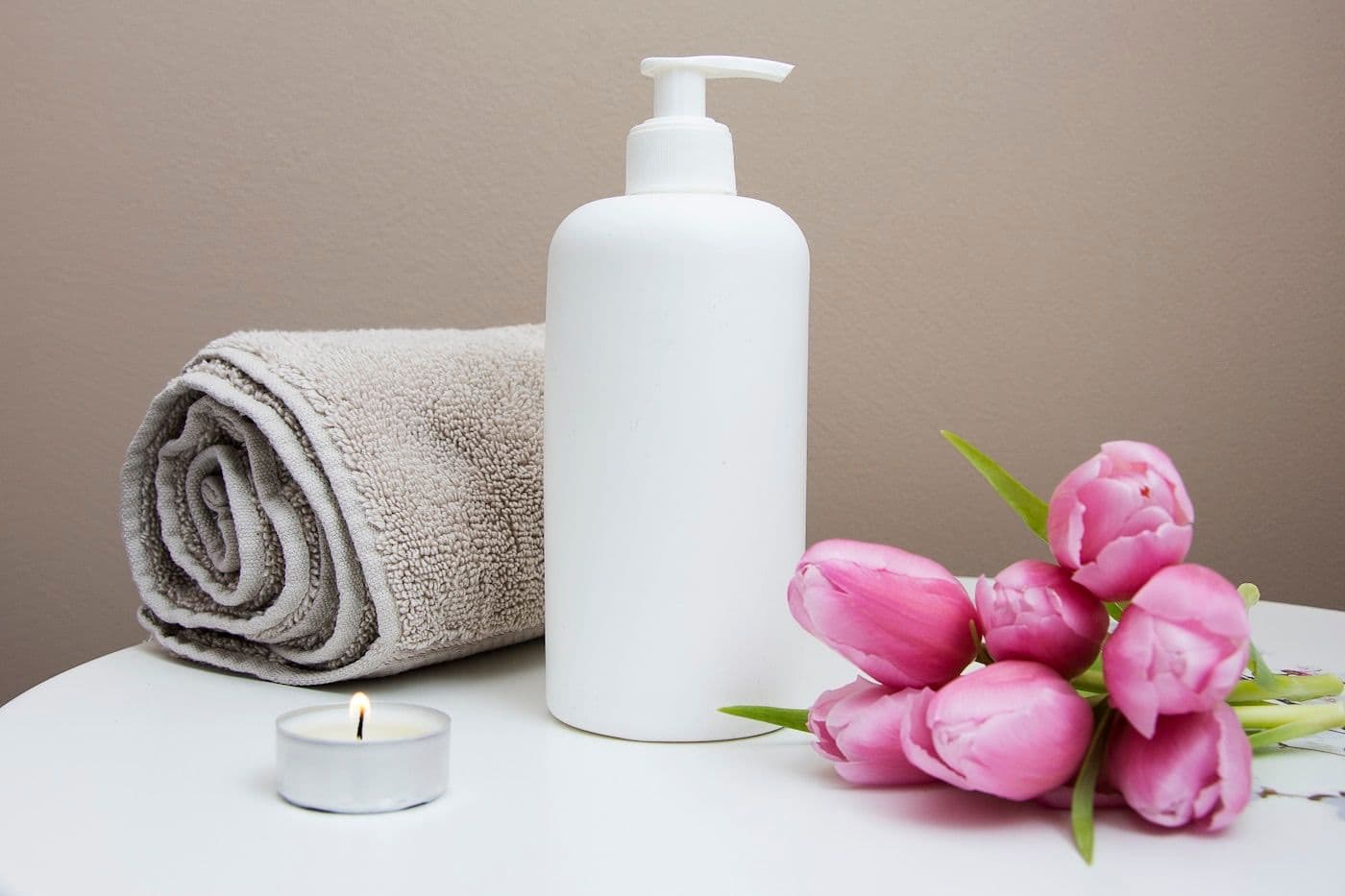 Soft skincare textures on linen